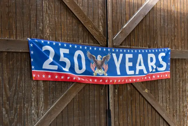 A "250 Years" banner hung on the ranch's barn doors