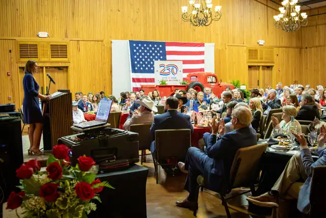 Governor Sanders and a full hall