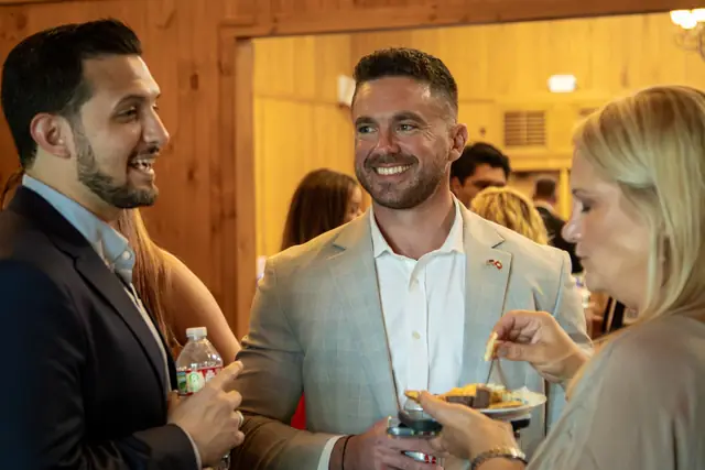 Guests catch up before the program