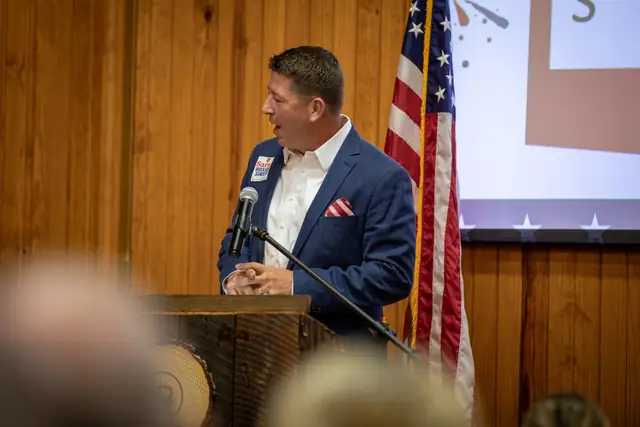 A speaker at the Legacy Ranch podium