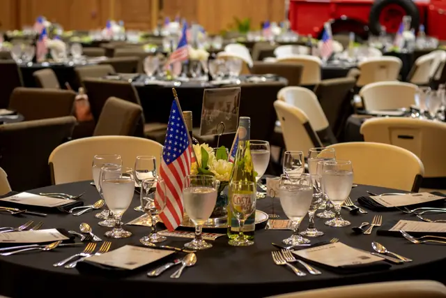 Tables set with flags for the semiquincentennial dinner