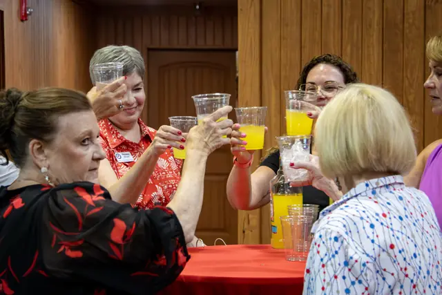 A toast among volunteers before doors opened