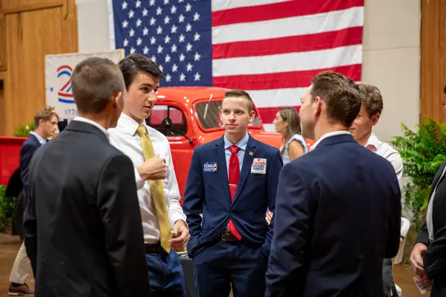 Younger attendees gather by the Power Wagon